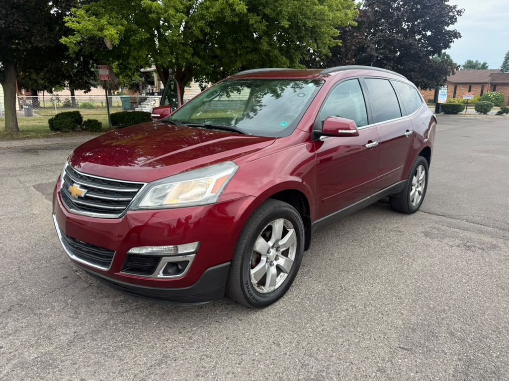 Red Chevrolet Traverse SUV photographed from the front three-quarter angle.